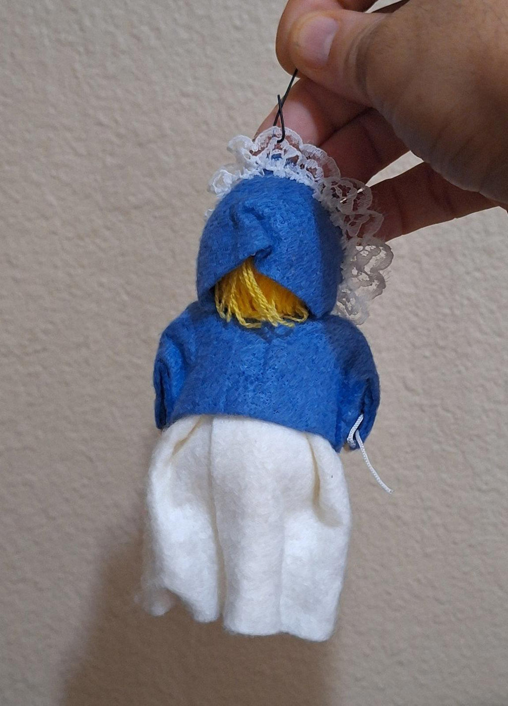 Handmade pilgrim girl ornament figurine back view, blue hood and white skirt