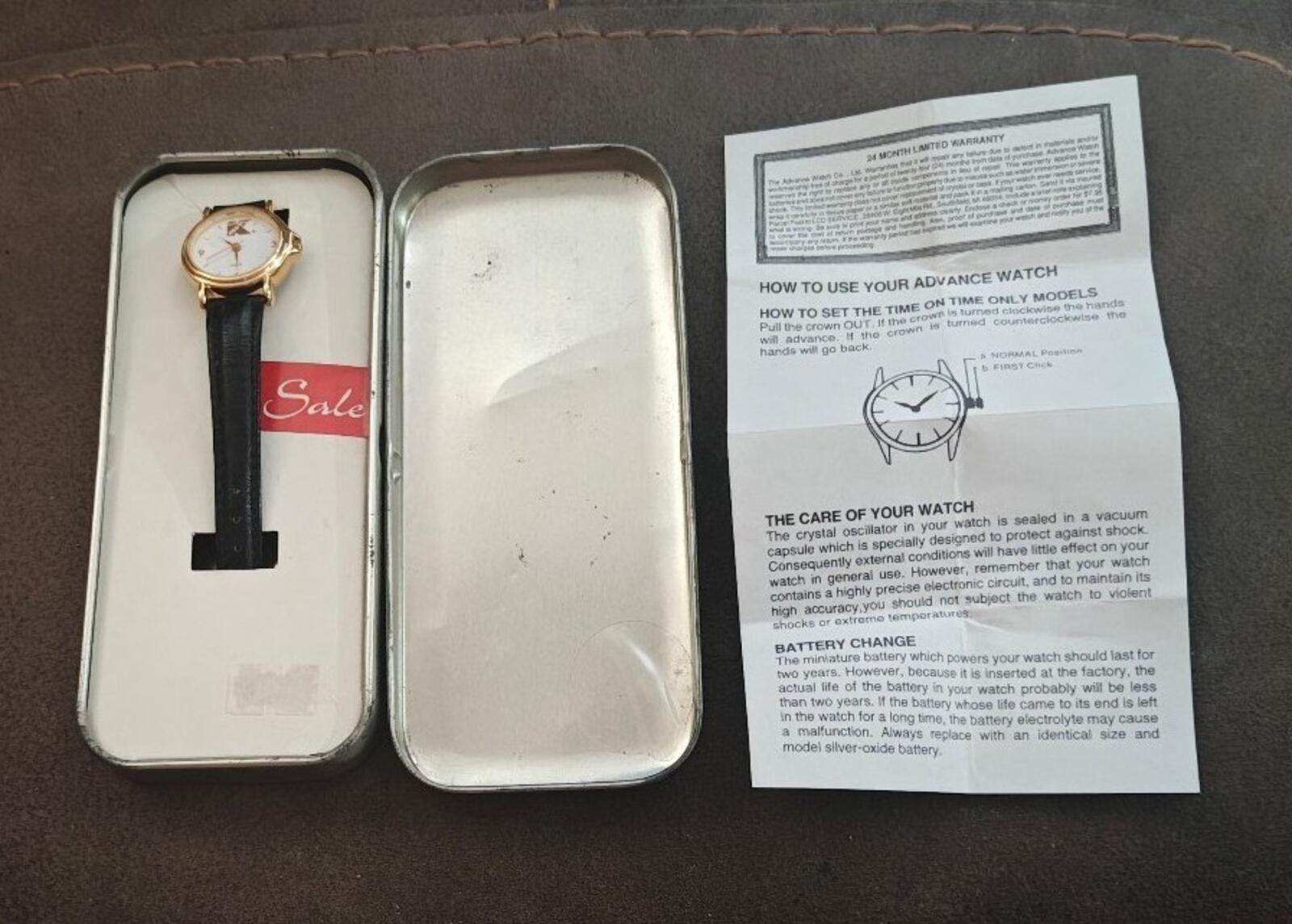 Ladies vintage watch and open instruction insert in box with black strap