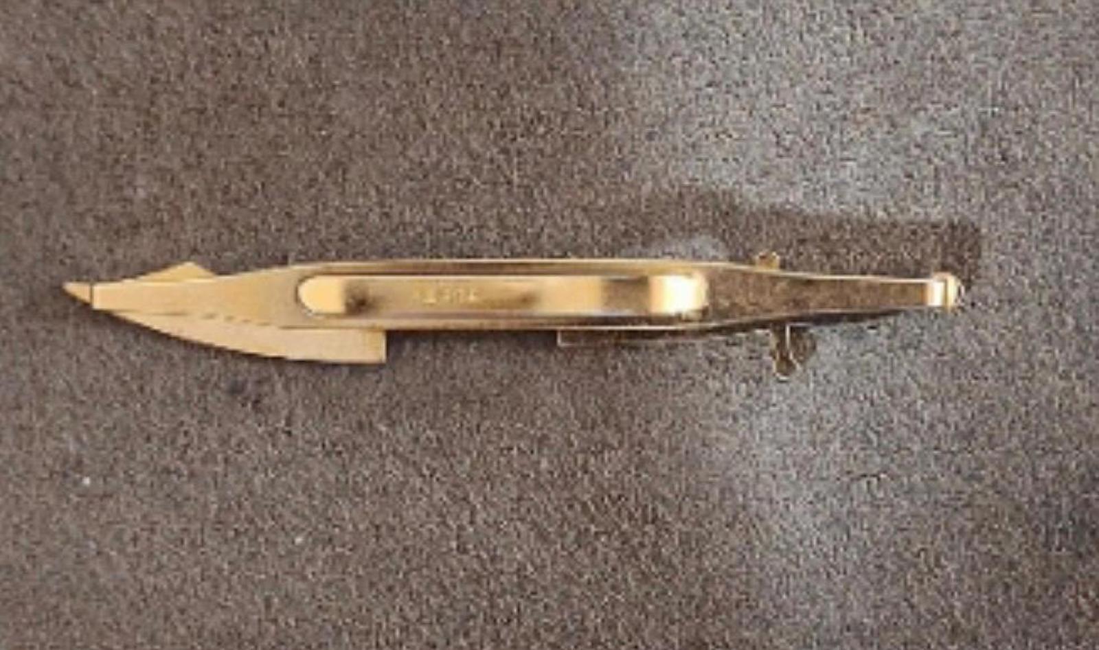 Gold pirate sword tie clip bar underside view with hinge and clasp details