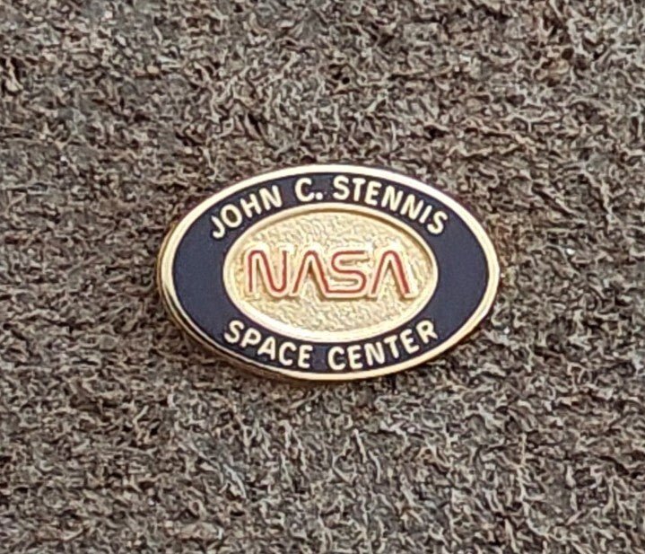 1980/90s NASA John C. Stennis Space Center Gold Tone Red & Black Enamel Pin. - Trinketmania-LV