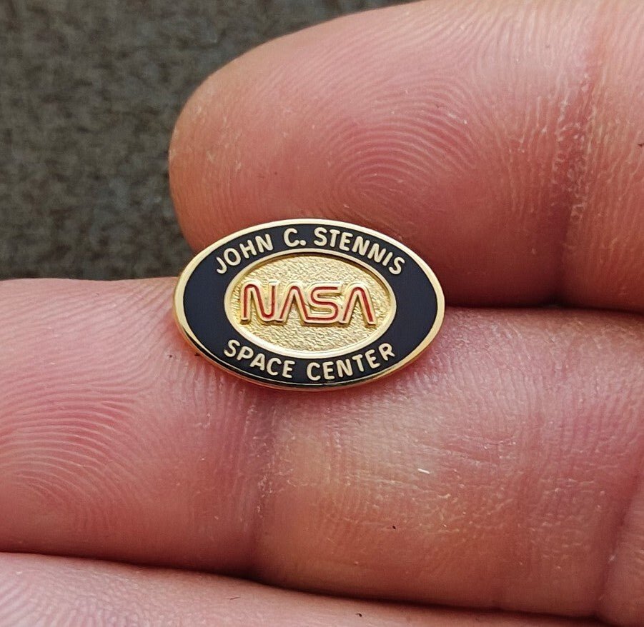 1980/90s NASA John C. Stennis Space Center Gold Tone Red & Black Enamel Pin. - Trinketmania-LV