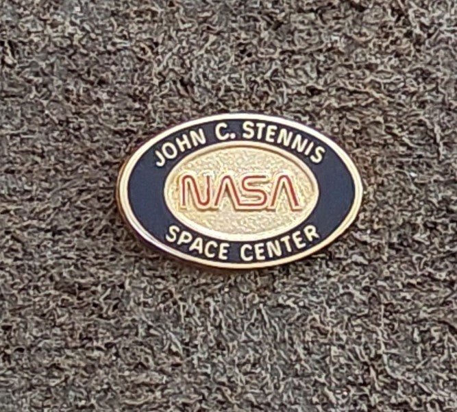 1980/90s NASA John C. Stennis Space Center Gold Tone Red & Black Enamel Pin. - Trinketmania-LV
