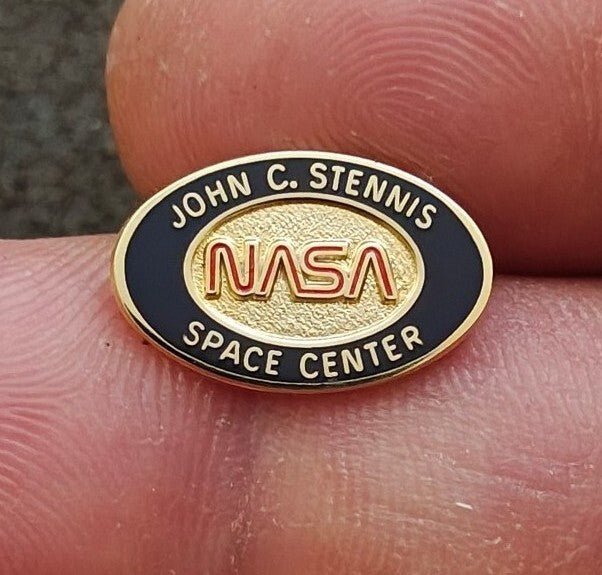 1980/90s NASA John C. Stennis Space Center Gold Tone Red & Black Enamel Pin. - Trinketmania-LV
