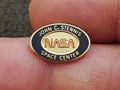 1980/90s NASA John C. Stennis Space Center Gold Tone Red & Black Enamel Pin. - Trinketmania-LV
