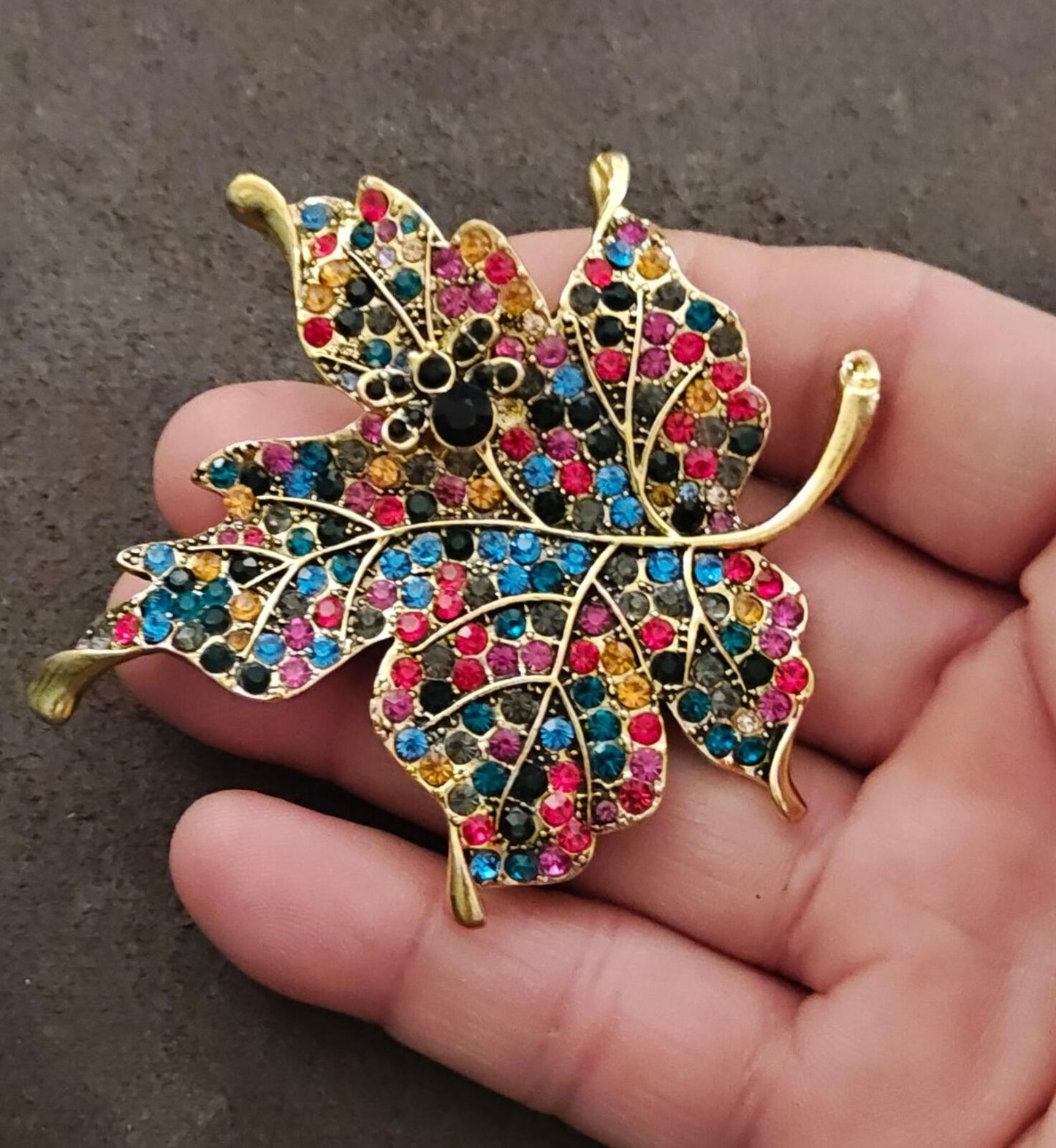 1980s Gold Tone Maple Leaf With Multi Colored Rhinestones Brooch