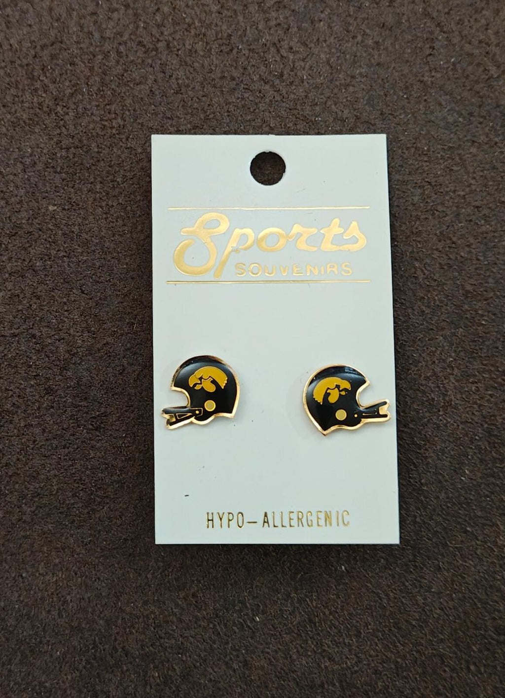 Pair of helmet-shaped gold-tone enamel stud earrings on display card