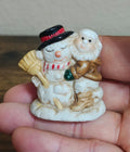 1993 Mercuries Miniature Snowman Hugging a Christmas Elf Or Gnome Ceramic Figure - Trinketmania-LV