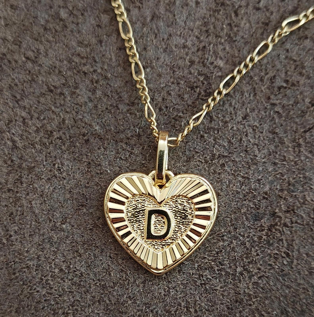 Gold tone heart pendant necklace with monogram D on link chain