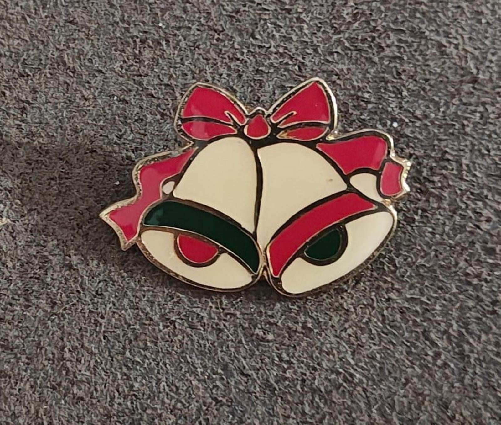 Gold tone enamel Christmas bells brooch with red and green enamel detailing, front view
