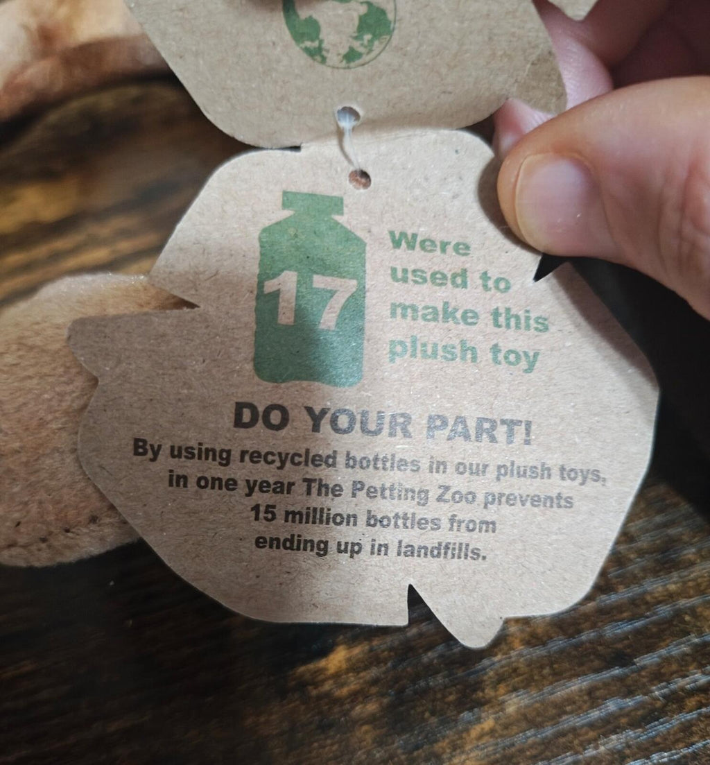 Recycling swing tag on plush scorpion reading DO YOUR PART and were used to make this plush toy