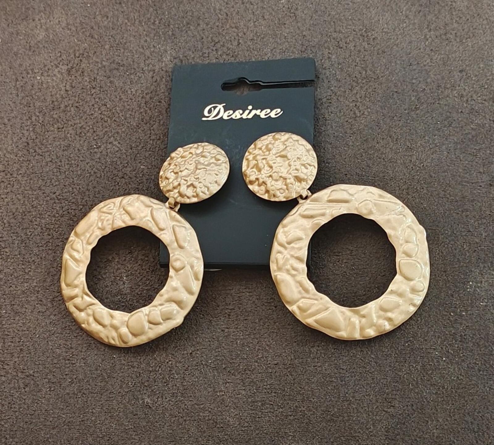 Gold-tone hammered statement earrings, round tops with oversized hoop-like pendants