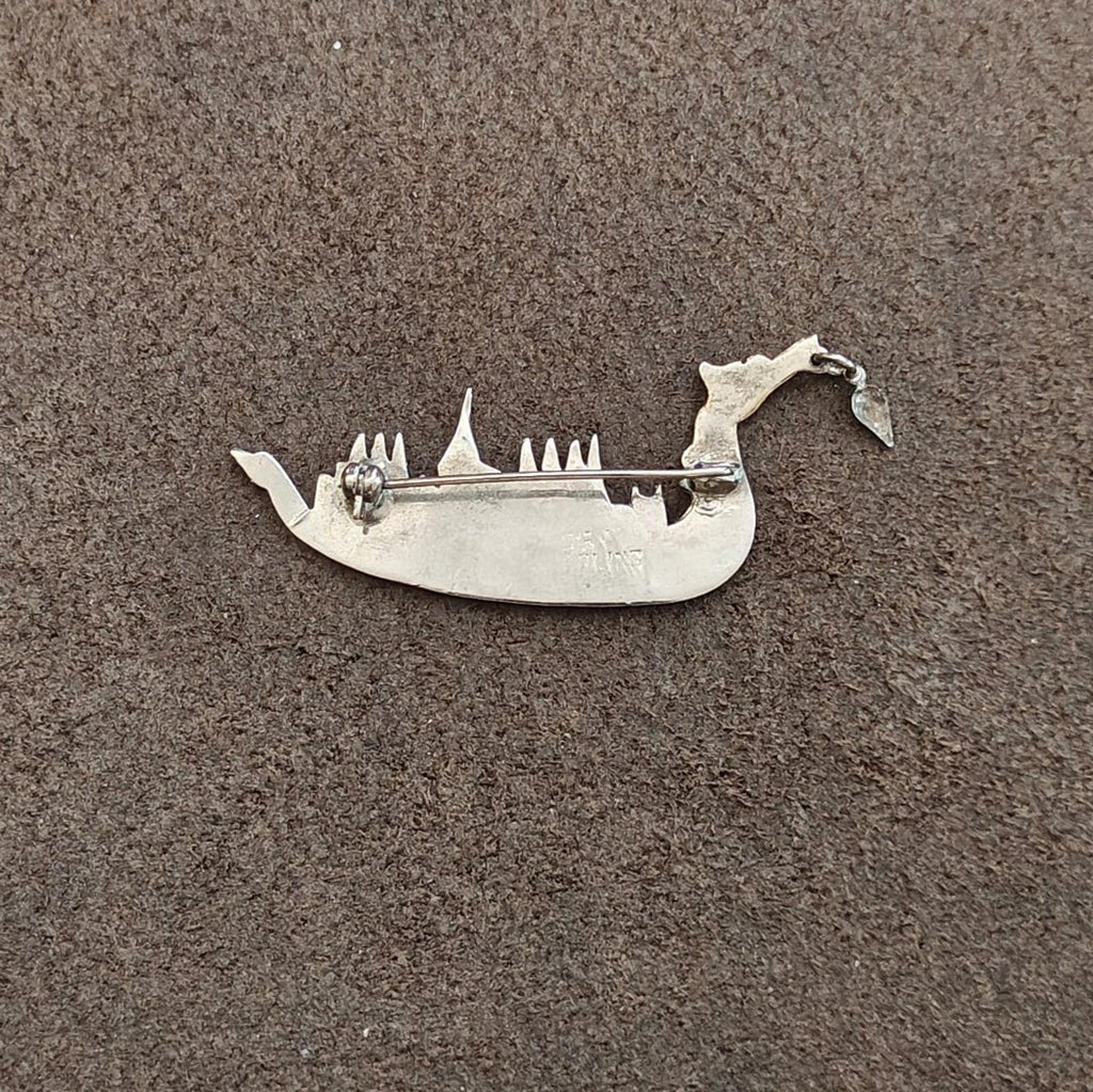 Sterling silver dragon brooch back view with pin and clasp hardware visible