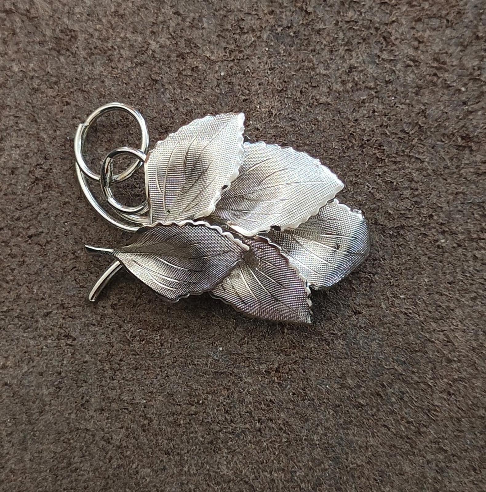 Silver textured leaf bunch brooch with ring loop and small pin stem