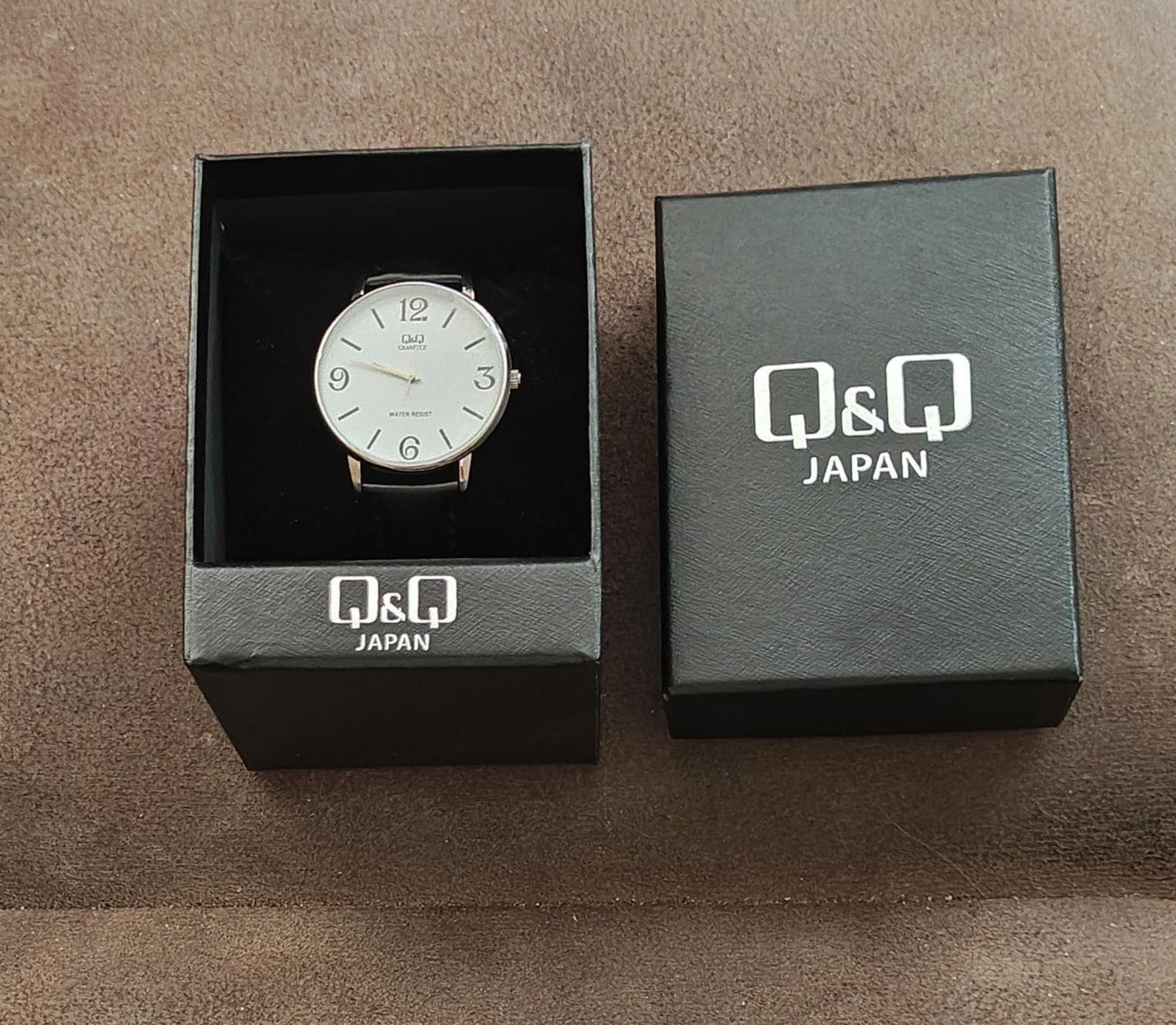 Q&Q Men's Analog Wrist Watch With White Dial and Black Leather Band.