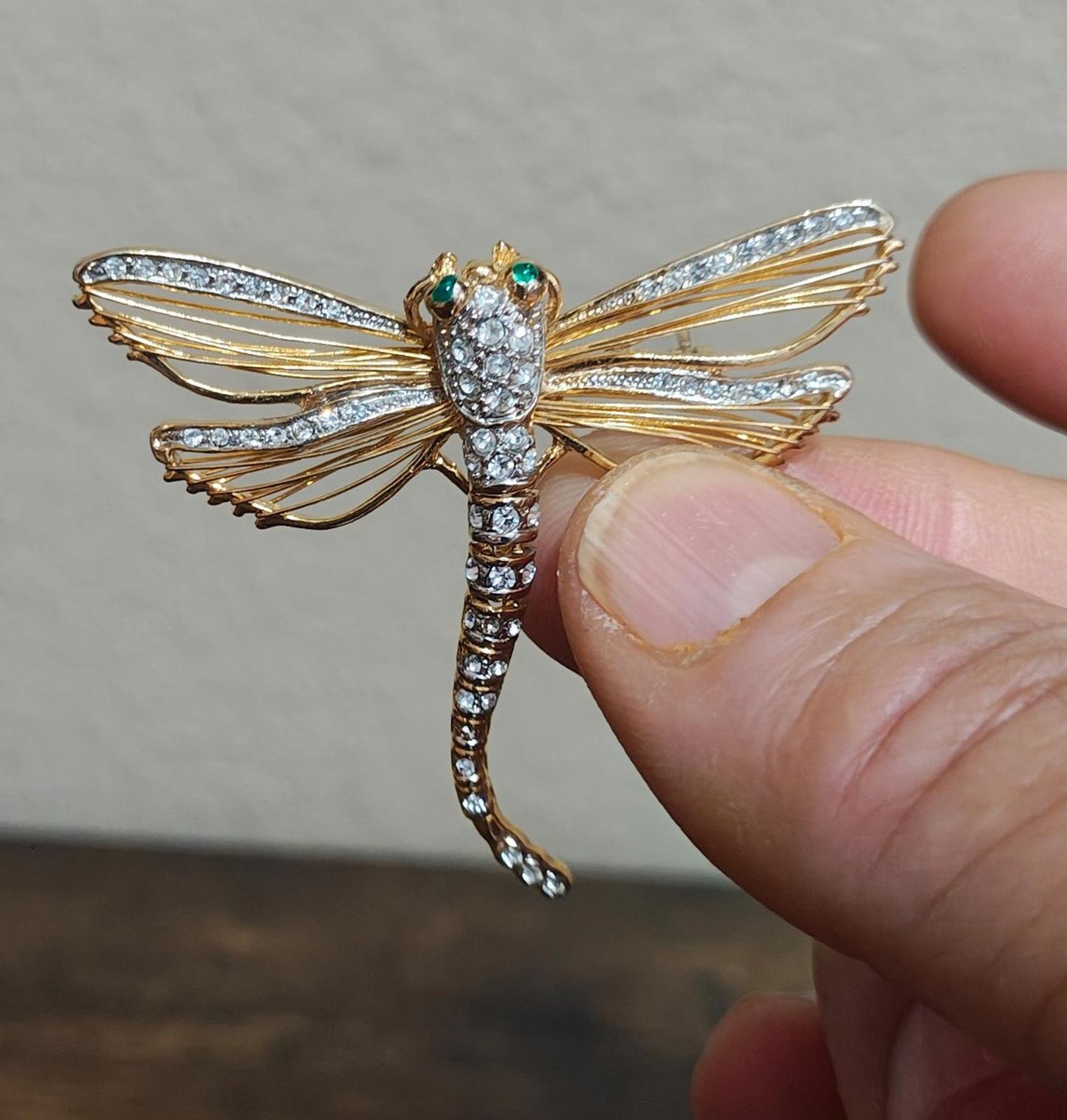 1990's Gold Tone With Clear Rhinestones and Green Enamel Eyes Dragonfly Pin