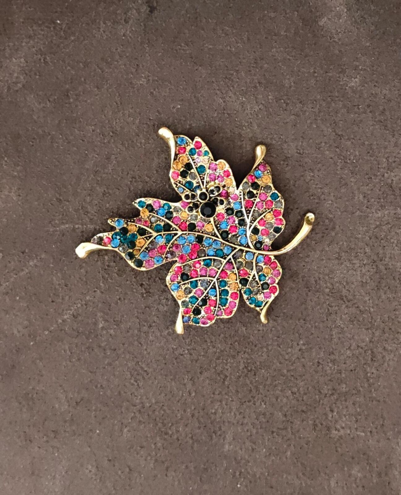 1980s Gold Tone Maple Leaf With Multi Colored Rhinestones Brooch