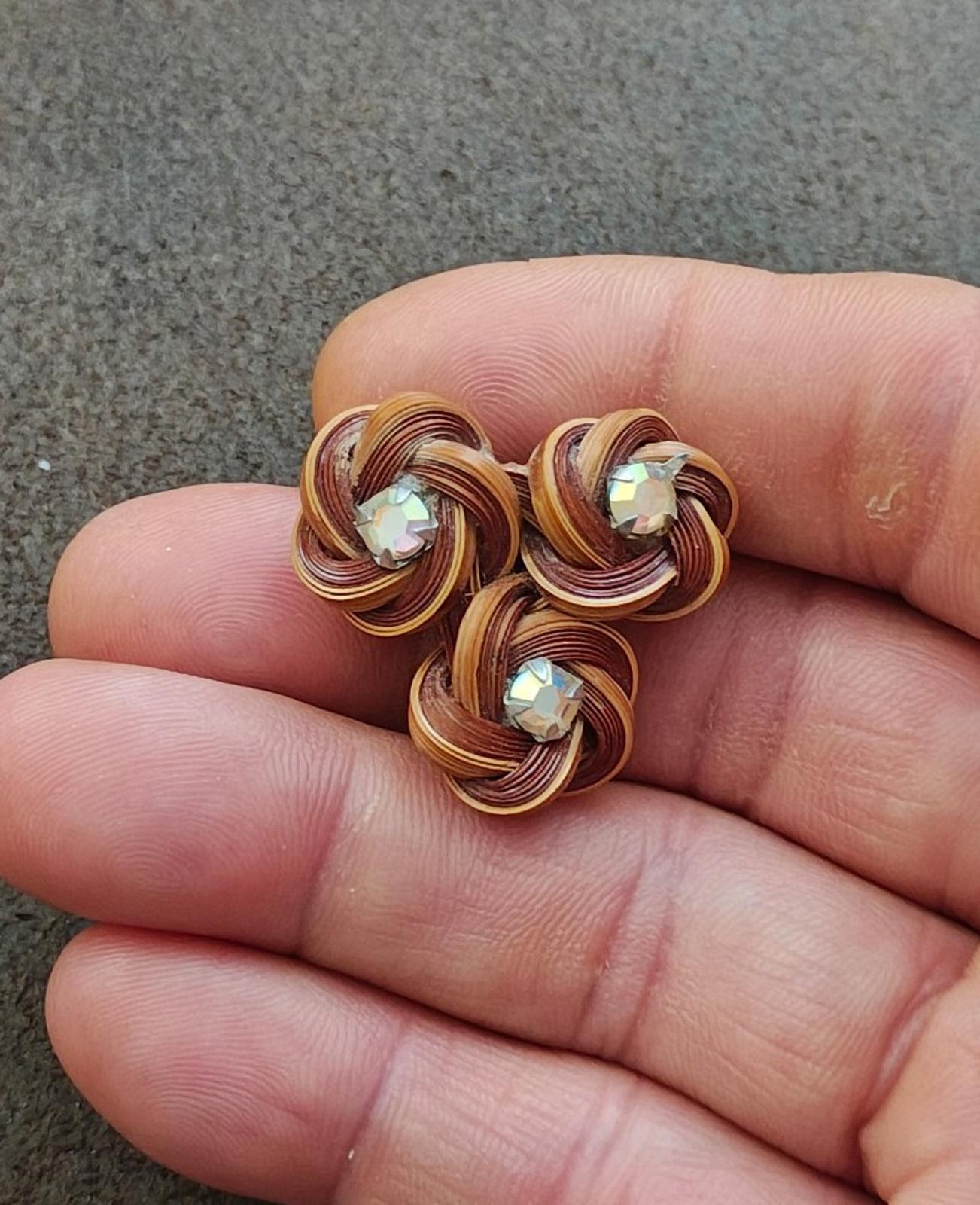 Three-flower bamboo rosette brooch with three rhinestone centers, brown coil petals
