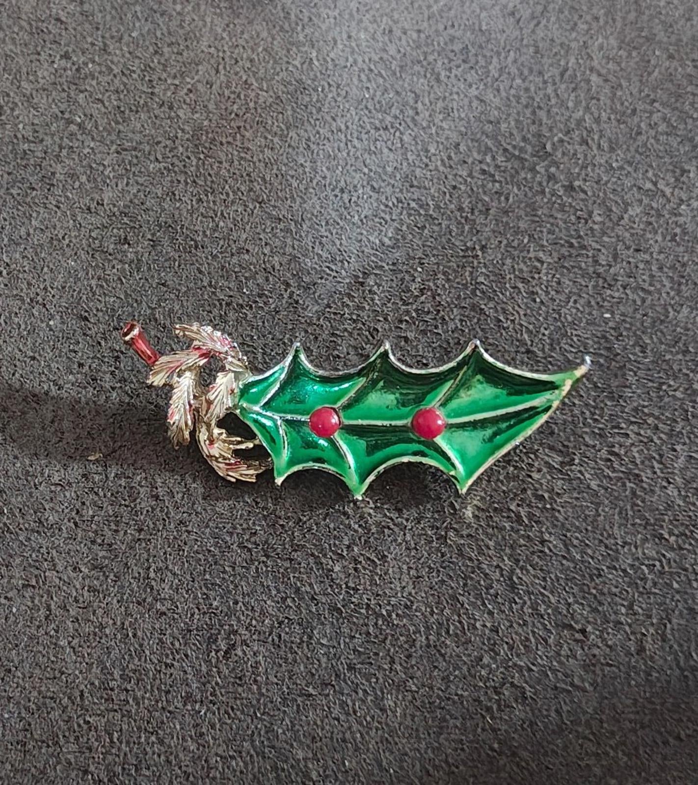 Holly enamel brooch pin: green pointed leaves, gold tone twig, red berry dots.