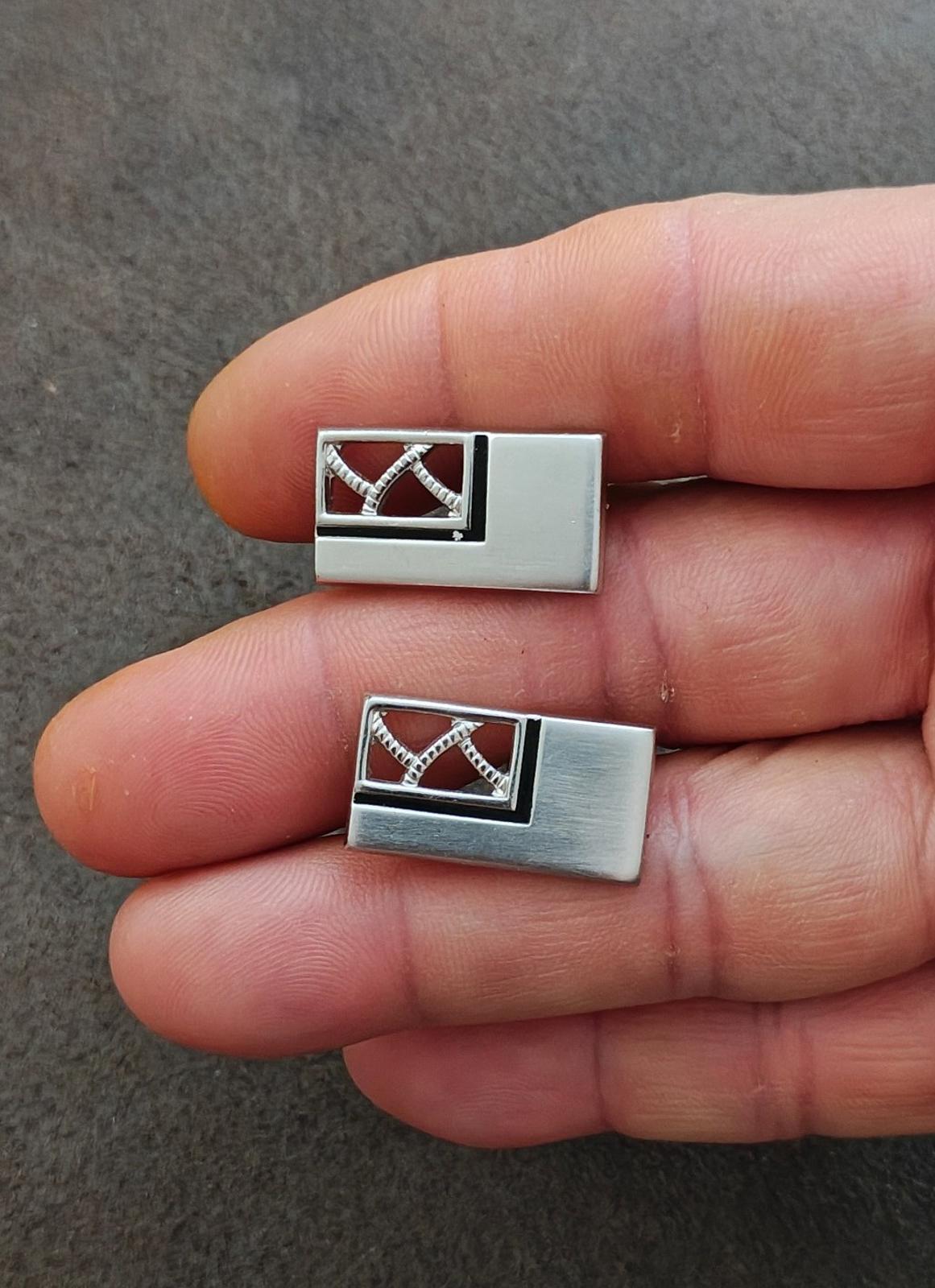 Silver-tone rectangular cufflinks with dark enamel center and crisscross pattern