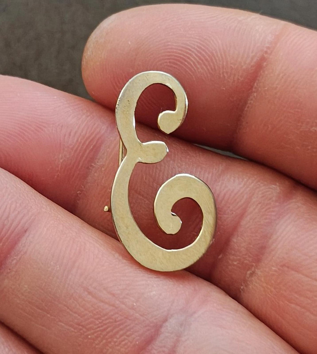 Gold tone monogram letter E brooch pin with raised curly design