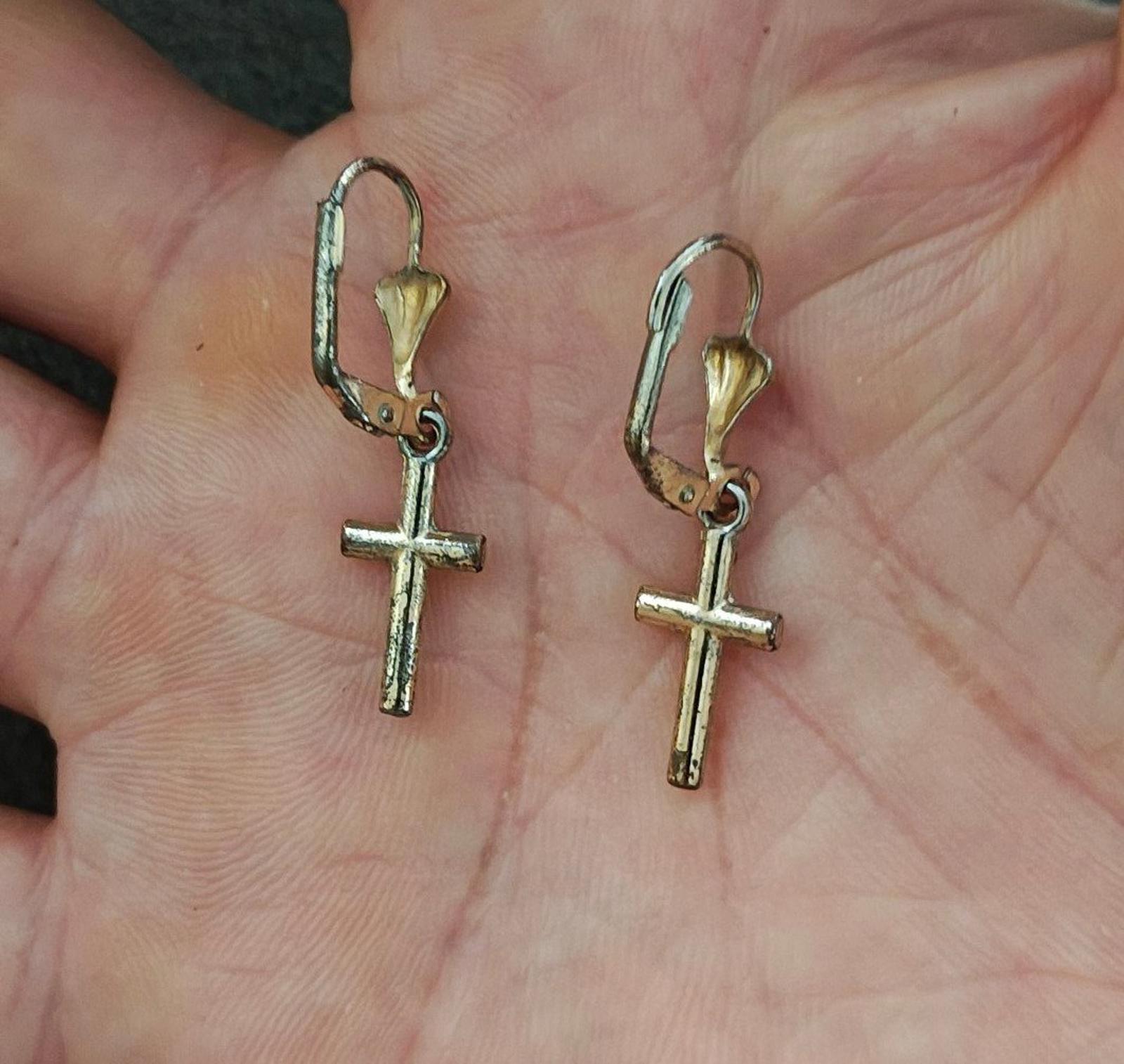 Gold-tone cross drop earrings with heart top charms and hinged hook backs.
