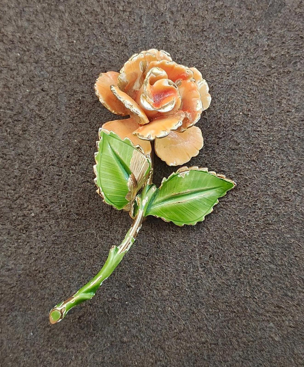 Gold-tone enamel rose and leaf pin, orange flower face with green leaves and stem