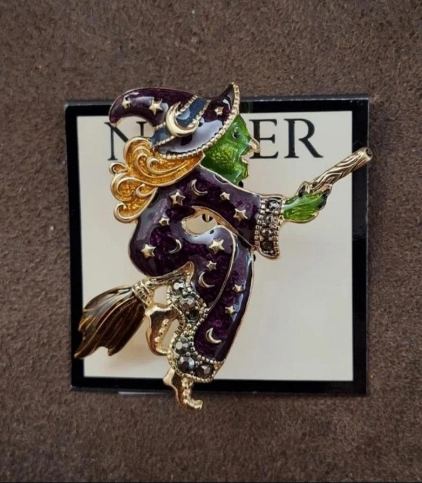 Gold-tone witch enamel pin brooch on display card, dark purple with green highlights