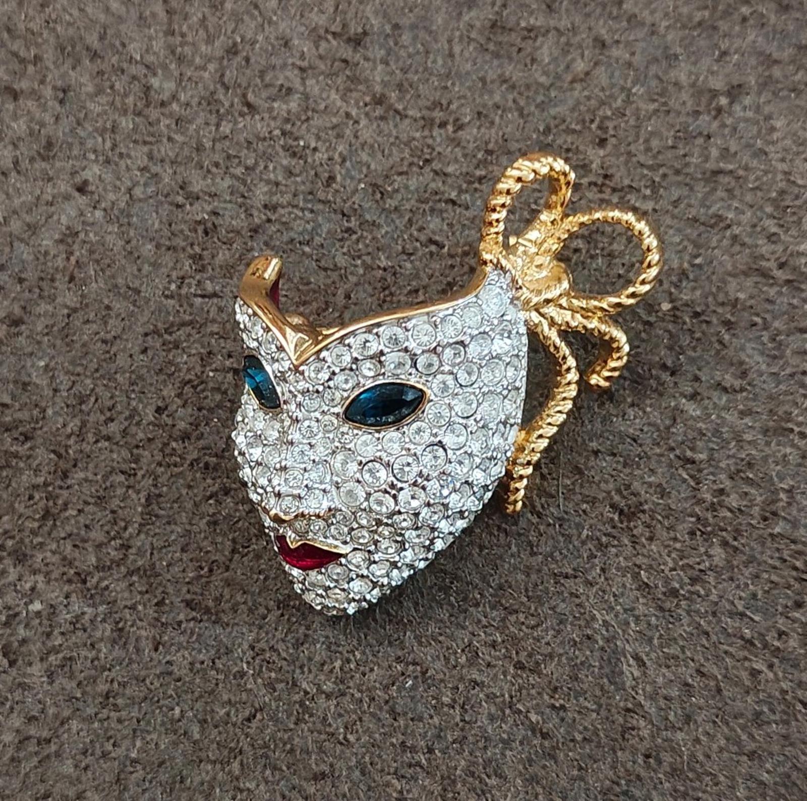 Swarovski crystal masquerade mask brooch with gold trim and ribbon detail