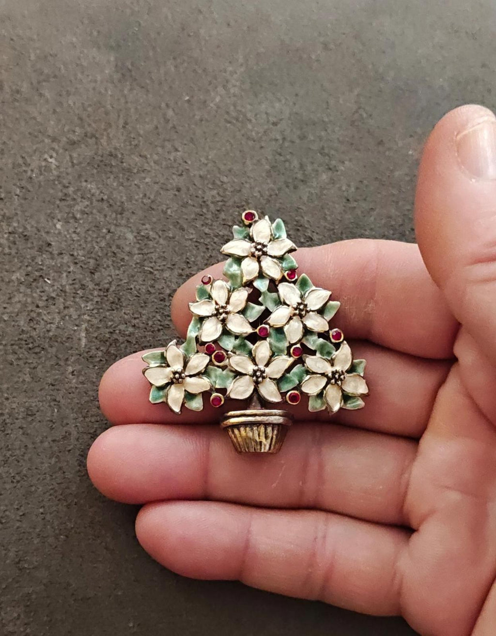 Christmas tree brooch with gold basket, white poinsettias, green leaves, red berry accents