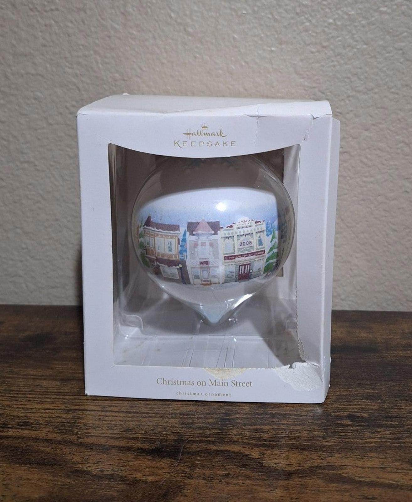 Hallmark Keepsake teardrop Christmas ornament in box with Main Street village scene