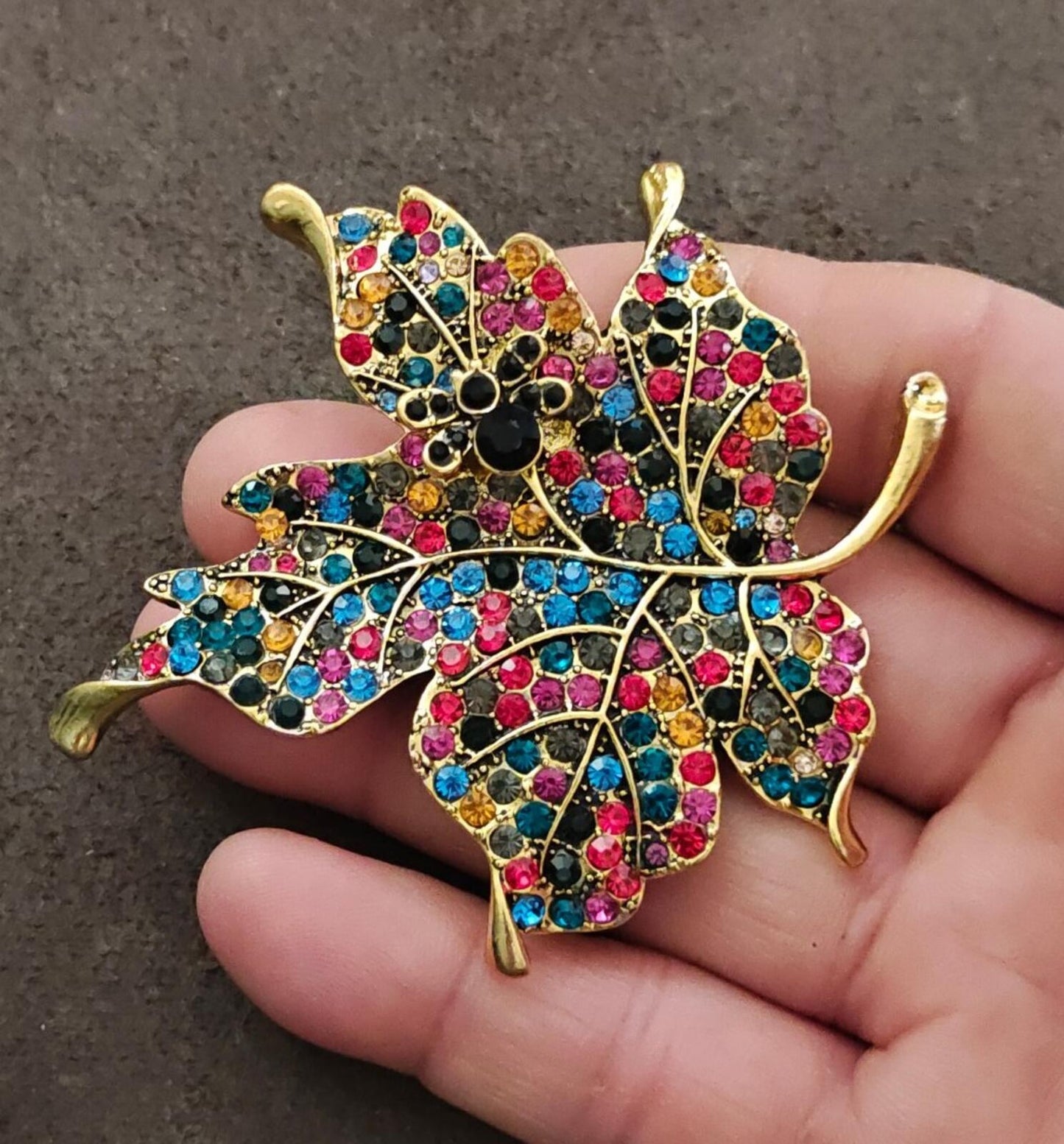 1980s Gold Tone Maple Leaf With Multi Colored Rhinestones Brooch