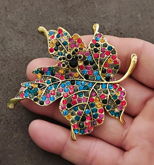 1980s Gold Tone Maple Leaf With Multi Colored Rhinestones Brooch