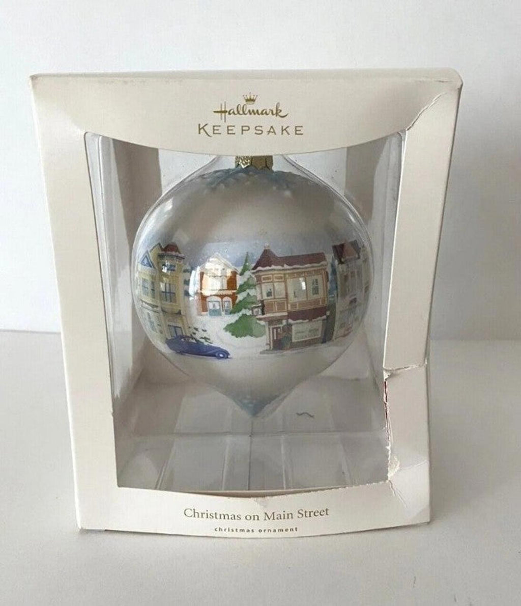 Hallmark Keepsake teardrop Christmas ornament in retail box with Main Street town scene