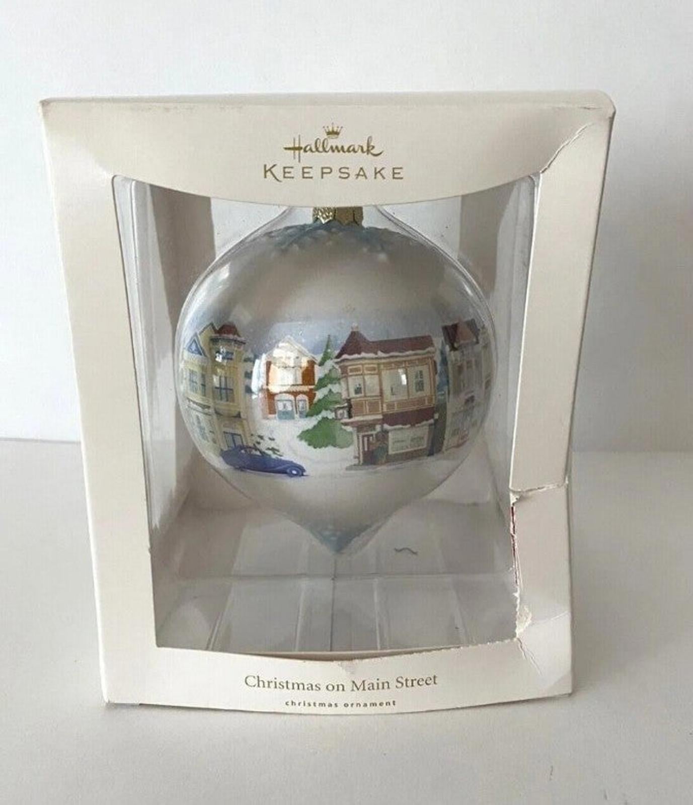 Hallmark Keepsake teardrop Christmas ornament in retail box with Main Street town scene