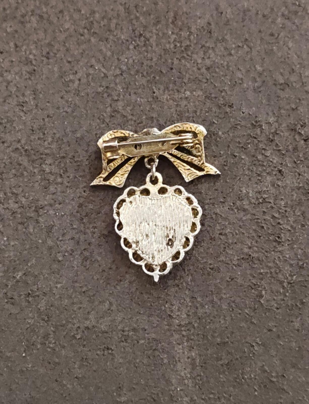 1980s Gold Tone Bow With Pink Flower & Filigree Edged Purple Stone Heart Brooch
