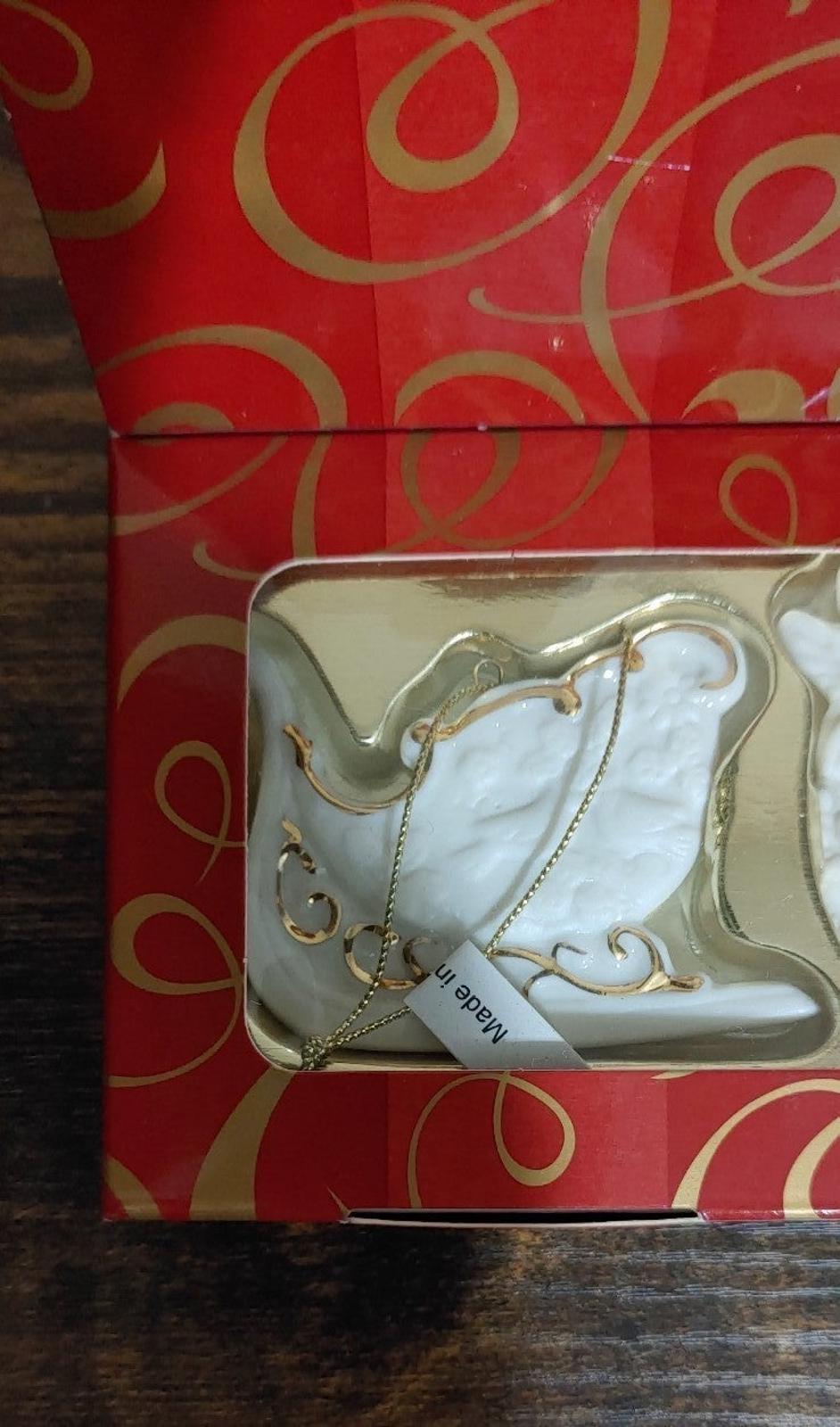 Bisque porcelain ornament boot design with gold trim in red gift box