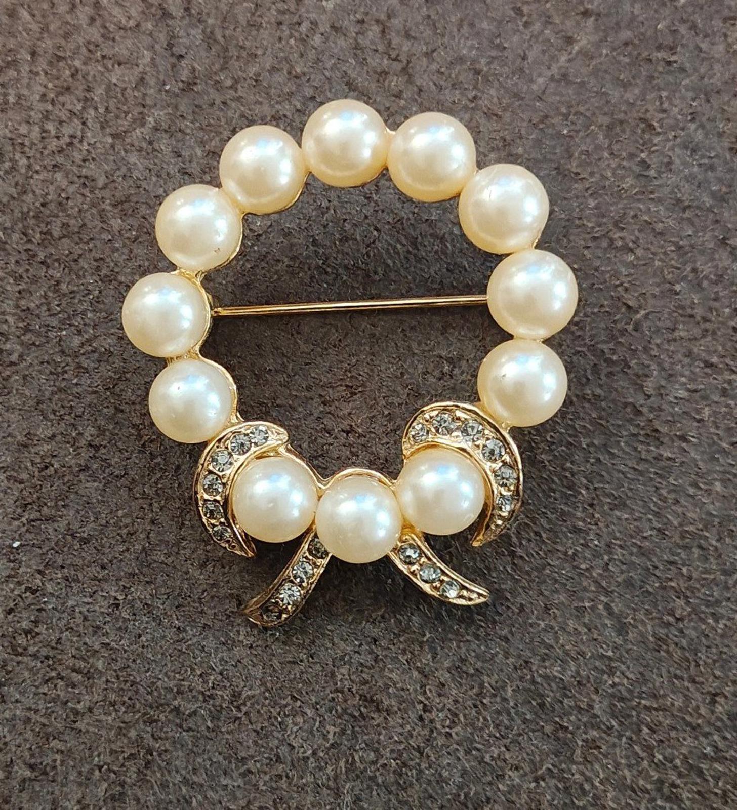 Gold-tone faux pearl wreath bow brooch with clear rhinestone trim and gold pin bar