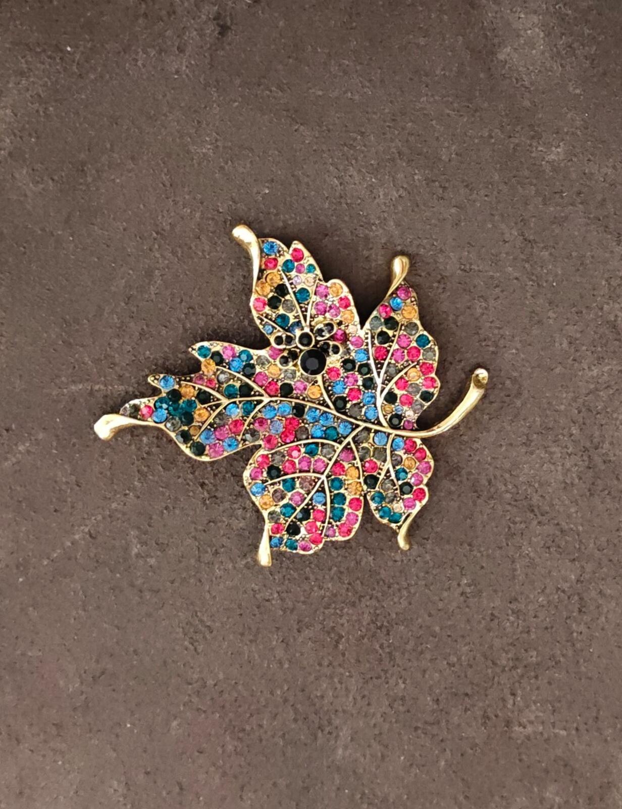 1980s Gold Tone Maple Leaf With Multi Colored Rhinestones Brooch