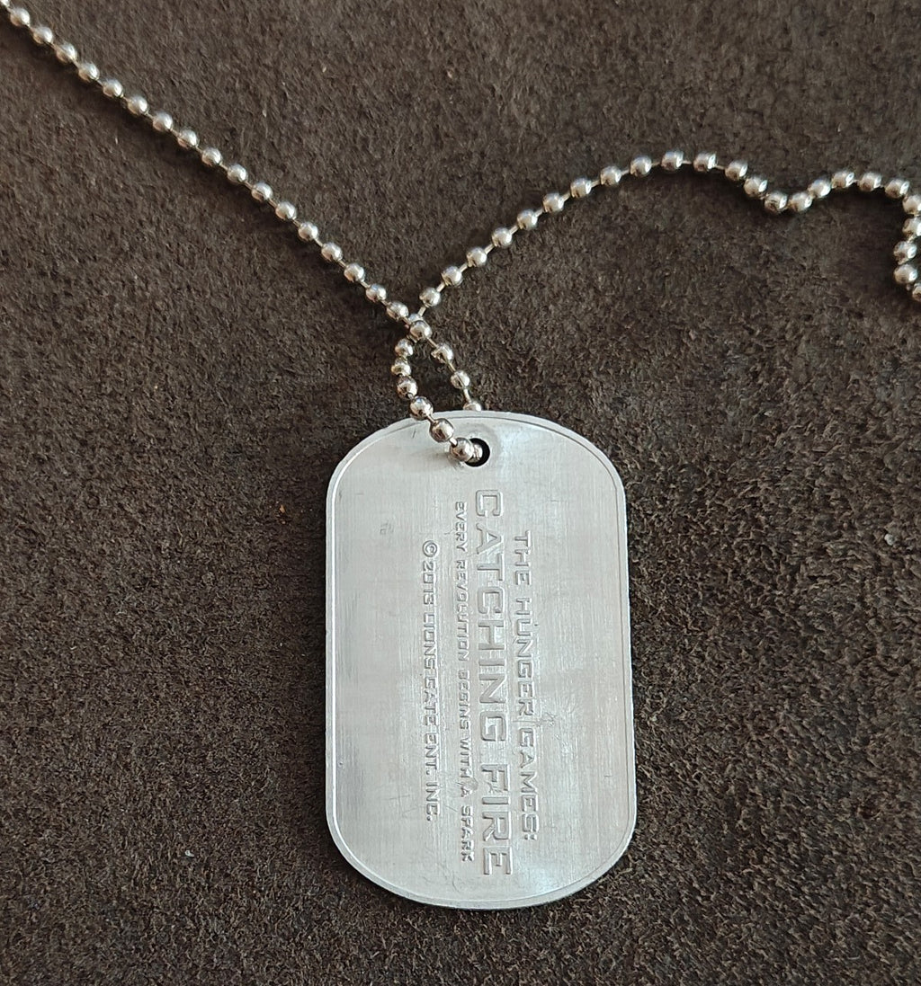 Promotional "The Hunger Games: Catching Fire" District 12 Victor Dog Tag