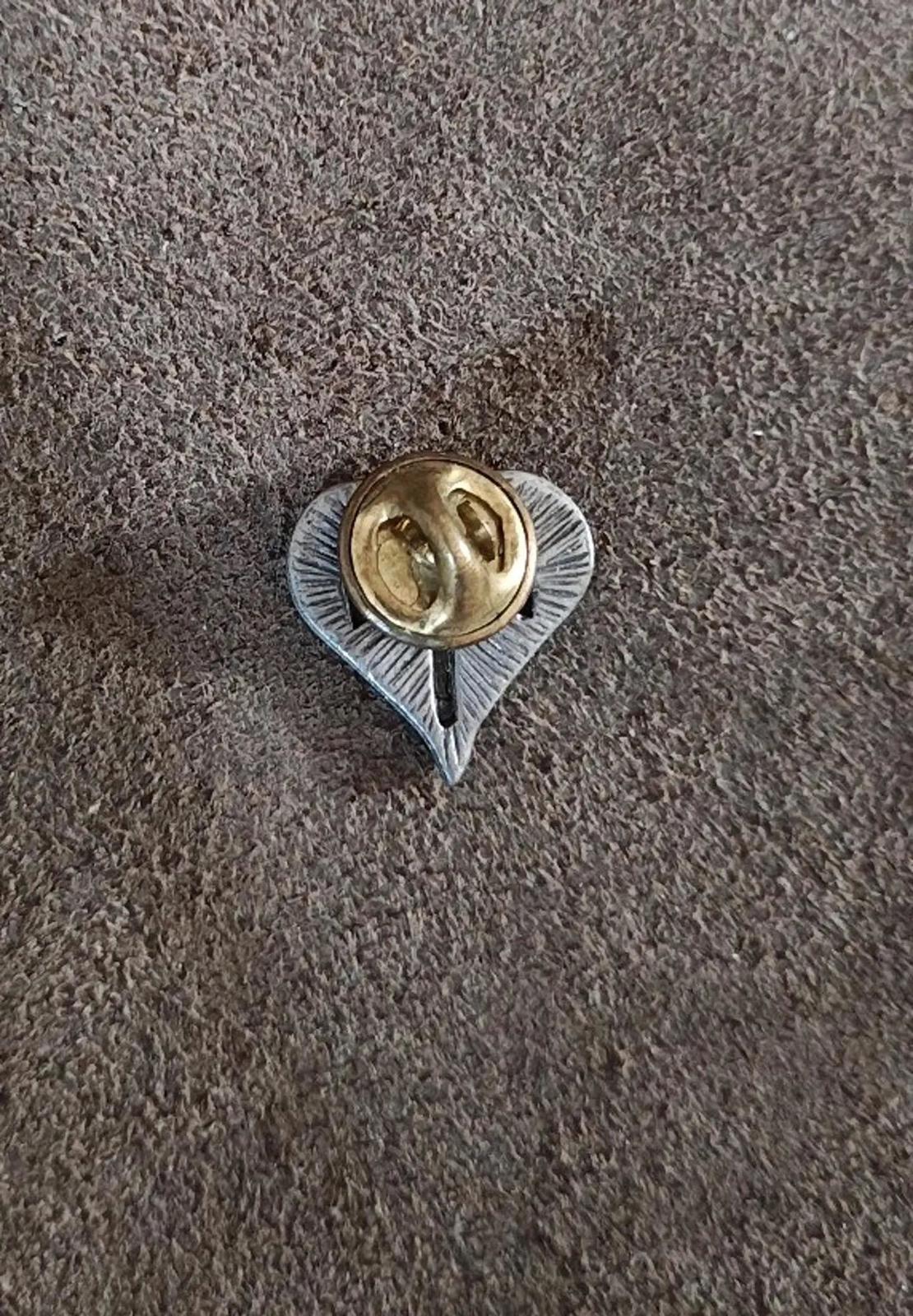 Pewter heart religious pin back with gold-toned safety clasp