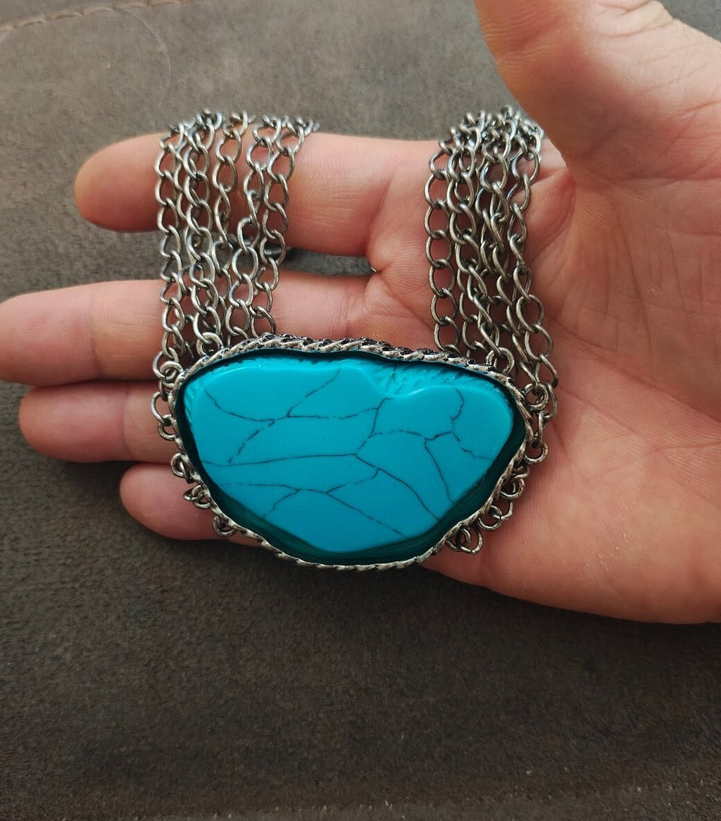 Silver Tone Multi Strand Chain Statement Necklace With a Faux Turquoise Stone