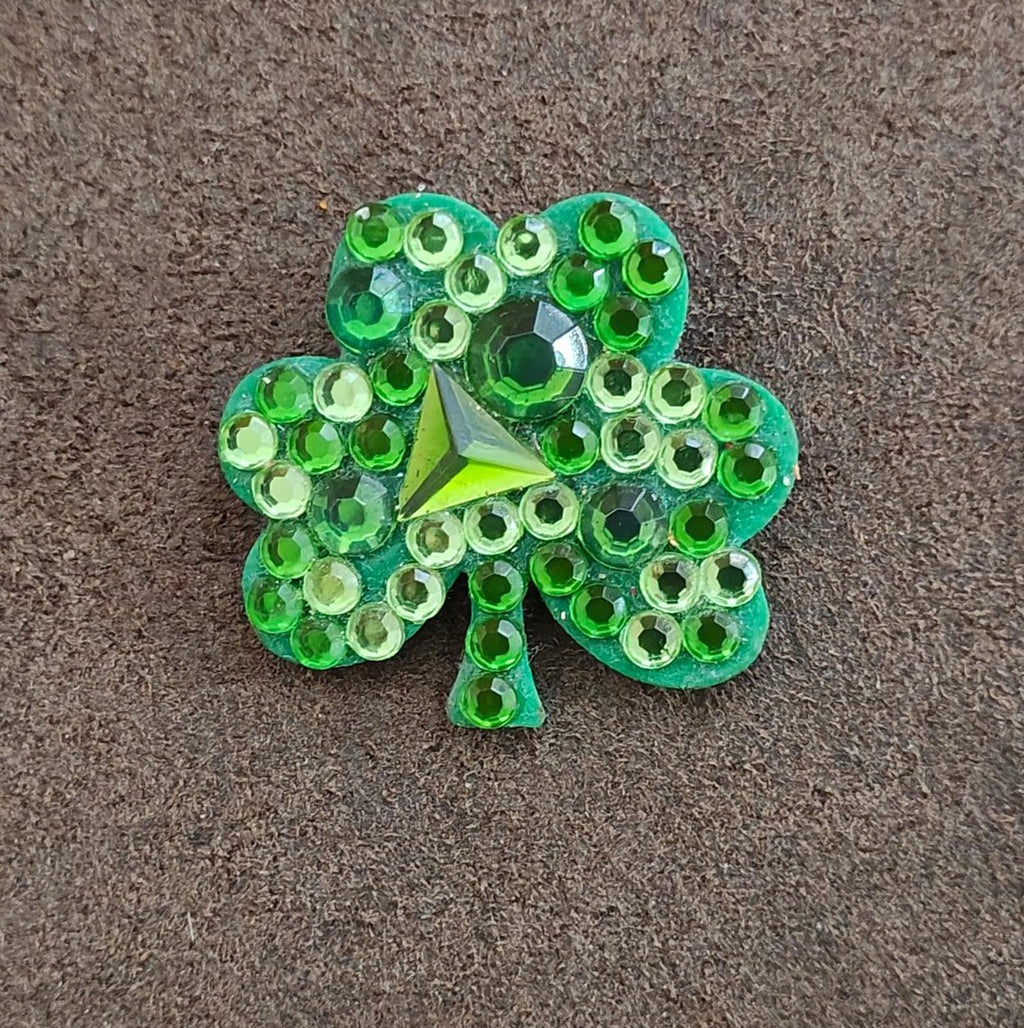 Green jeweled shamrock brooch pin with faceted stones and star centerpiece