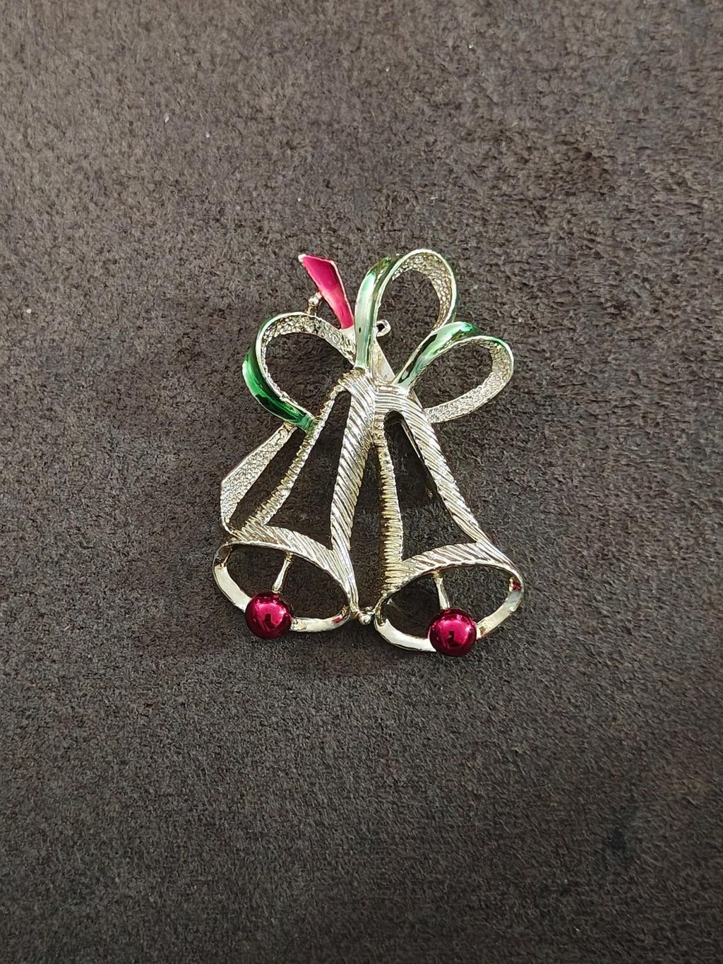 Gold-tone holiday bell brooch with green red enamel ribbon and two round red bead drops