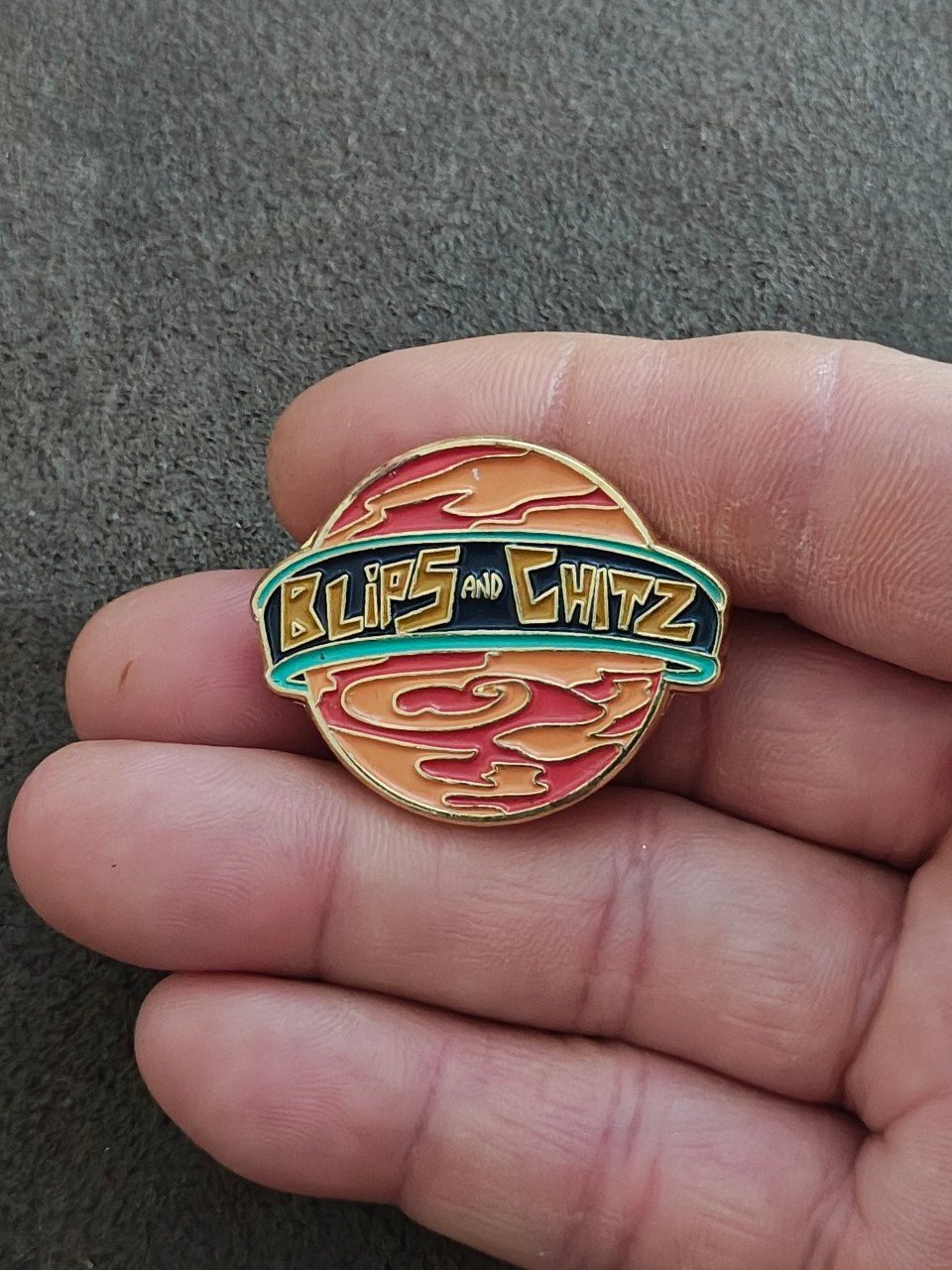 Funko Rick & Morty Blips & Chitz Exclusive Gold Tone Orange Enamel Pin.