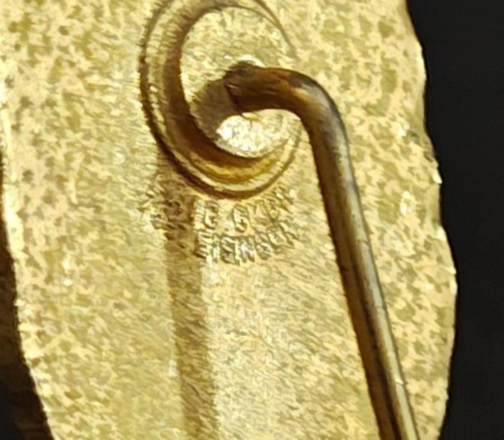 Gold-tone badge pin back with curved pin wire and textured gold finish