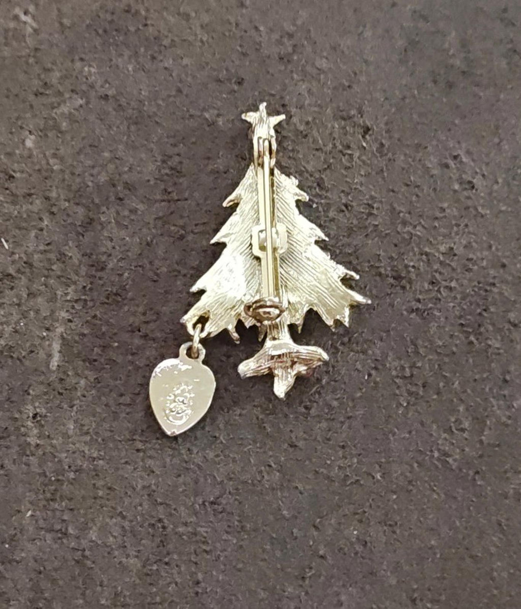 Rear view of Christmas tree brooch with dangling heart charm on gold-tone backing