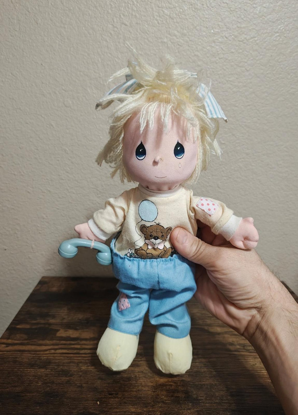 Vintage boy doll plush with blond yarn hair, cream shirt, and blue overalls, blue eyes
