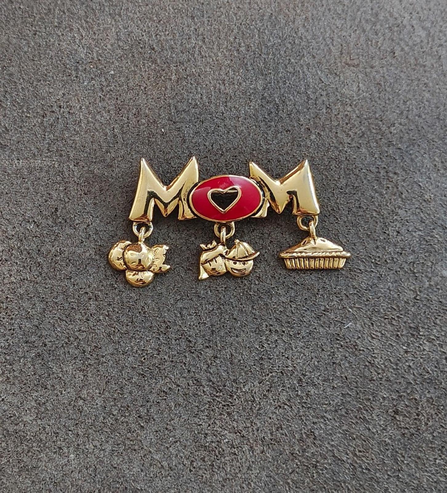 Gold-tone MOM brooch pin with red heart enamel center and bar with dangling charms