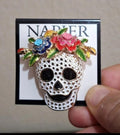 Silver tone sugar skull pin with colorful flowers and black eyes