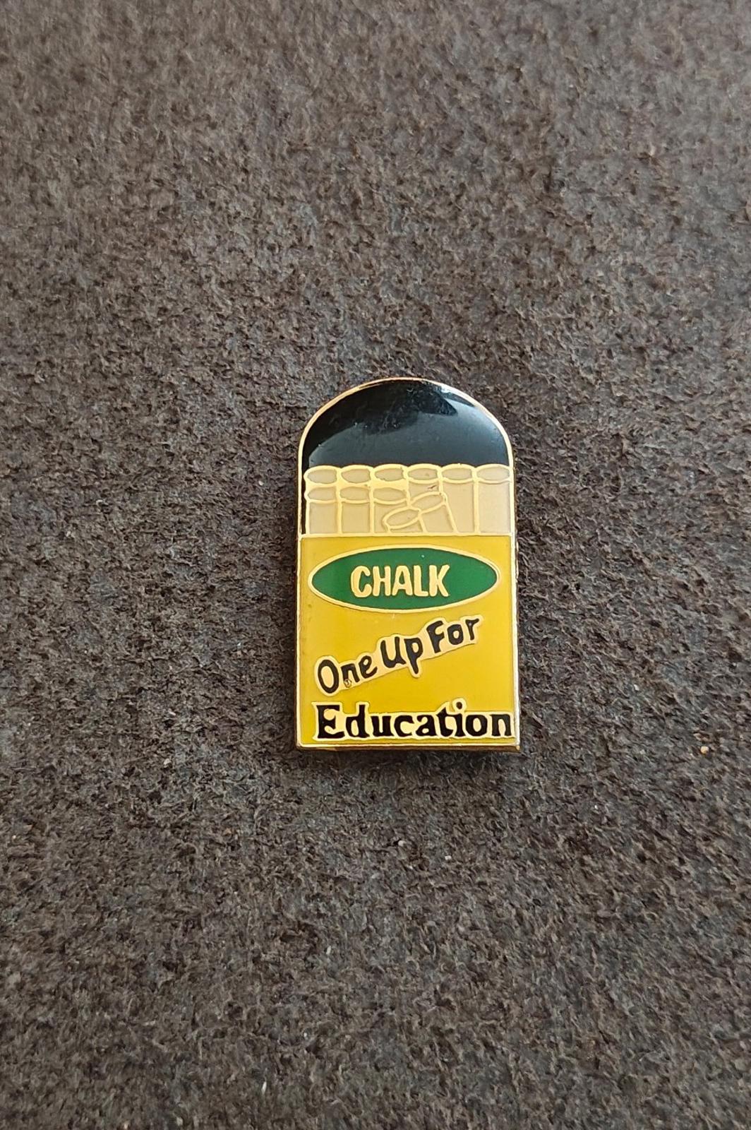 Gold-tone enamel teacher pin, chalkboard design with “CHALK” and “One Up For Education”